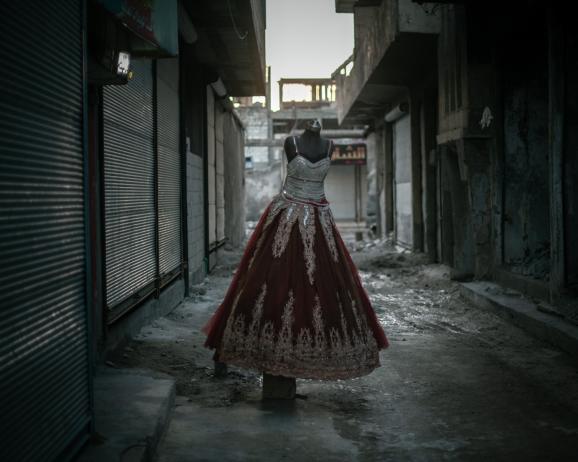 An evening dress in the city of Raqqa. Despite the war and the destruction, life is slowly going back to normal for the resilient inhabitants of the city.