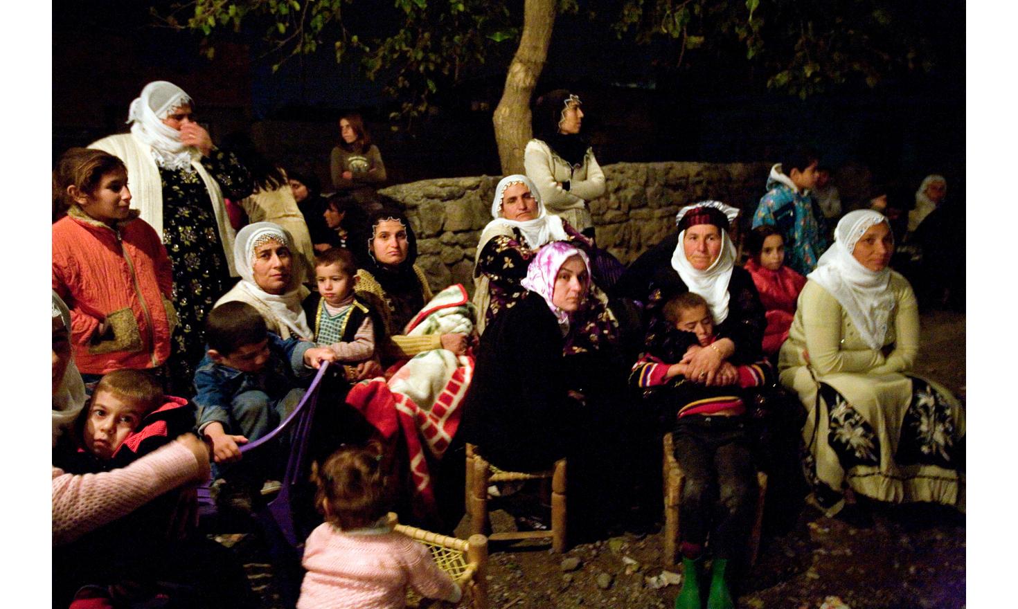 Women sit during a Kurdish wedding in ben-u-sen street - district of Sehitlik. Diyarbakir, Turkey, November 25, 2006