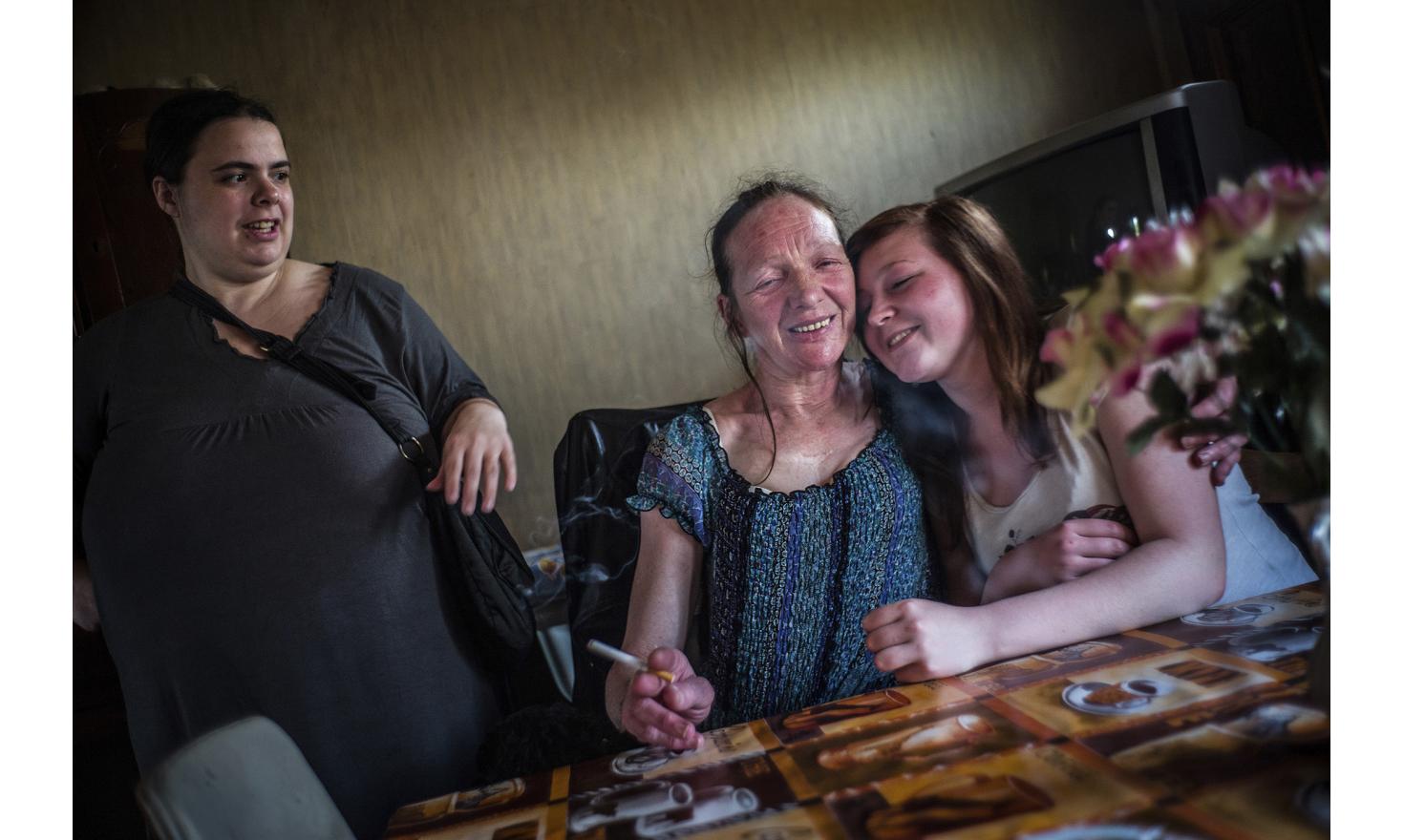 ©Ulrich Lebeuf / M.Y.O.P Aurelie is Sebastien's wife, Isabelle's other son. She is five months pregnant. Her three previous kids were sent to foster care. Amandine is making a slight tender but uneasy gesture.