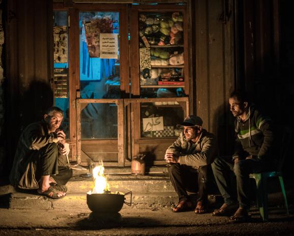 Inhabitants from Gaza City light up a fire to light themselves but also to burn waste and warm themselves up.