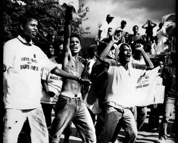 Supporters of Nobel Prize Jose Ramos Horta shouting at the Freitilin pro Lu-Olo supporters passing next to them. The last day of Presidential elections campaign, around 30 people got injured during clashes between rival political party supporters. 